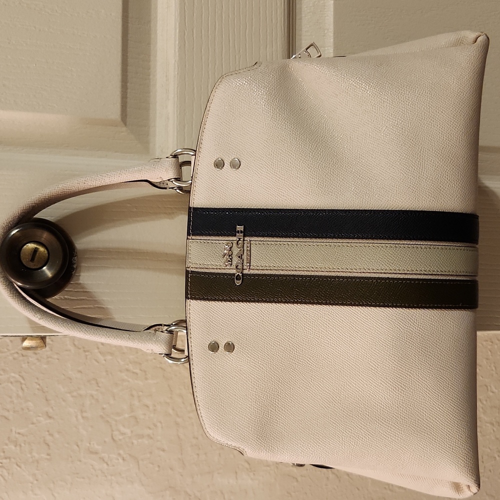 Coach Lillie Carryall with Varsity Stripe